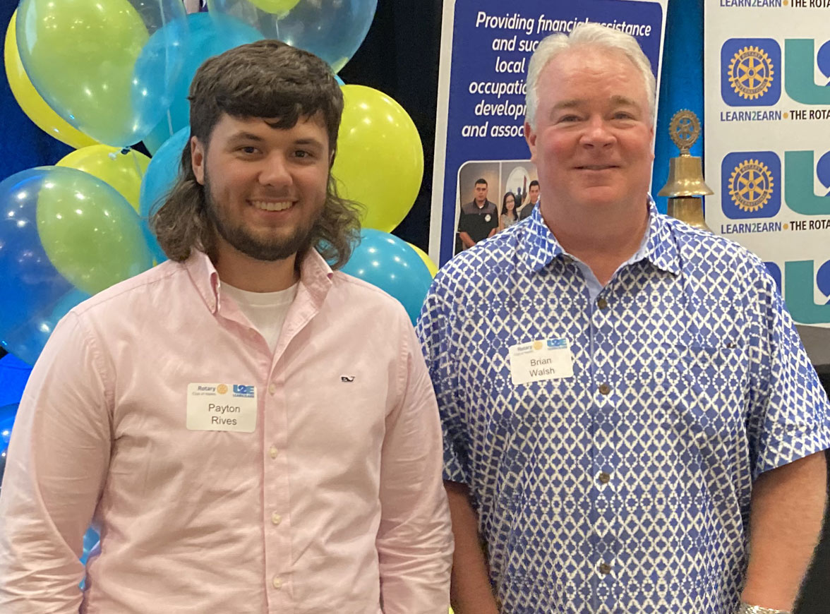 Learn2Earn Student Scholarship Recipient with their Success Coach at a Learn2Earn Event
